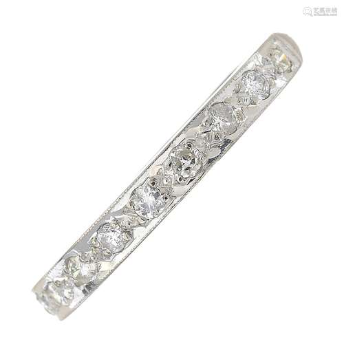 A diamond half eternity ring.Estimated total diamond weight 0.25ct.Stamped 18ct.