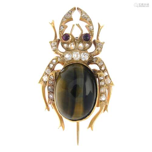 A tiger's-eye, ruby and diamond beetle brooch.Estimated dimensions of tiger's-eye cabochon 16.5 by