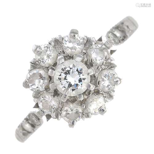 A diamond cluster ring.Estimated total diamond weight 0.60ct, H-I Colour, SI-P1 clarity.