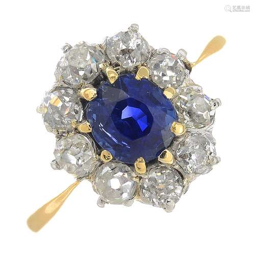 A sapphire and diamond cluster ring.Sapphire weight 1.09cts.Estimated total diamond weight 0.90ct,