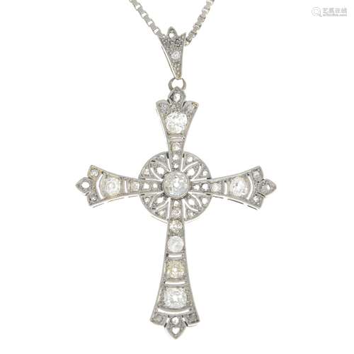 A diamond cross pendant,