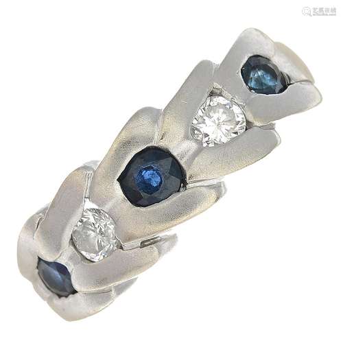 A sapphire and diamond ring.Estimated total diamond weight 0.25ct,