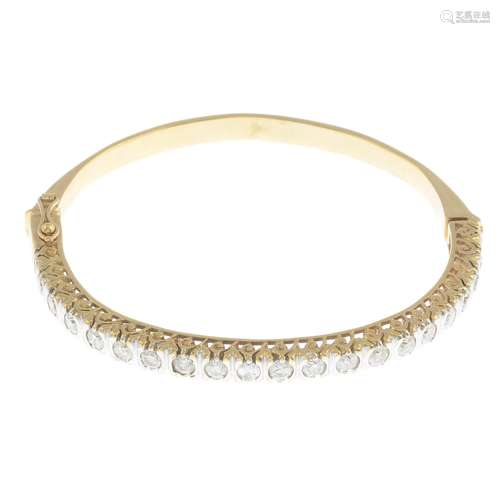 A 9ct gold diamond hinged bangle.