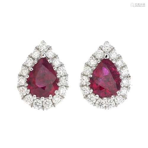 A pair of 18ct gold ruby and diamond cluster earrings.Total ruby weight 0.54ct.Total diamond weight