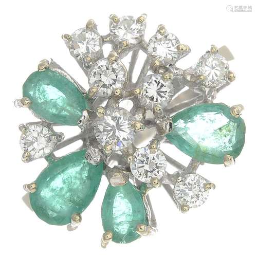 An emerald and diamond ring.Estimated total diamond weight 0.55ct,