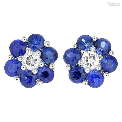 A pair of 18ct gold sapphire and diamond floral cluster earrings.Estimated total diamond weight