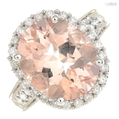 A 9ct gold morganite and diamond cluster ring.Estimated total diamond weight 0.35ct.Hallmarks for