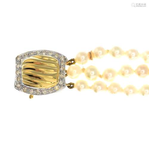 A cultured pearl three-row bracelet, with an 18ct gold diamond clasp.