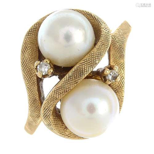 A cultured pearl and diamond dress ring.Approximate dimensions of cultured pearls 6.8 to 7mms.