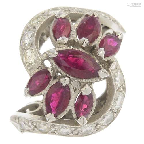 A ruby and diamond dress ring.Estimated total diamond weight 1ct.Ring size M.