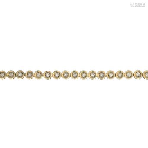 A 9ct gold diamond bracelet.