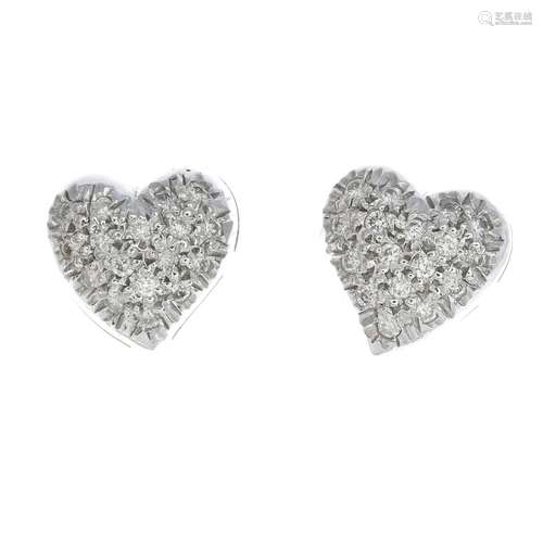 A pair of 18ct gold diamond heart earrings.Estimated total diamond weight 0.20ct.Hallmarks for