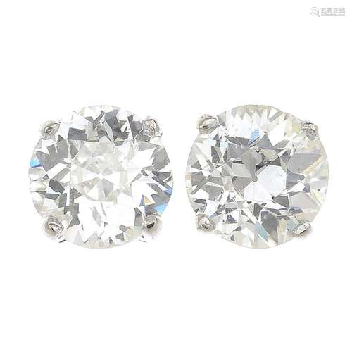 A pair of old-cut diamond single-stone stud earrings.Estimated total diamond weight 1.80cts,