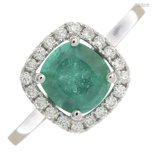 An 18ct gold emerald and diamond cluster ring.Emerald weight 1.25cts.Total diamond weight 0.18ct,