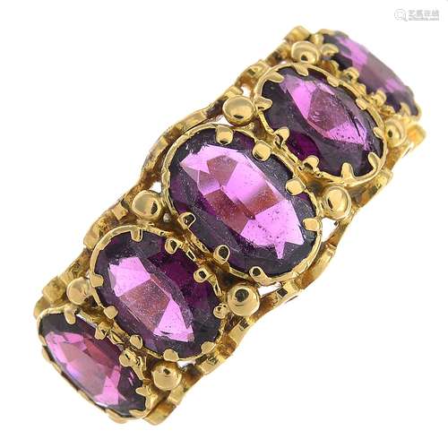 A late 19th century gold garnet five-stone ring.Ring size M.