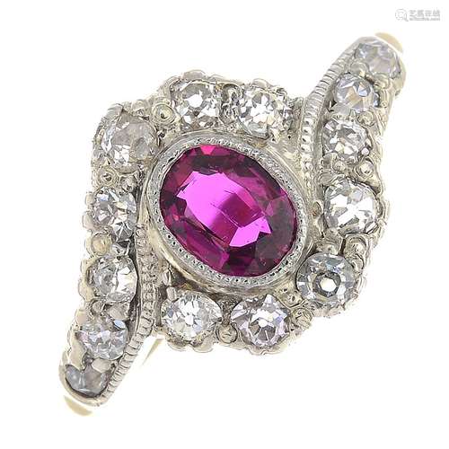 A ruby and diamond dress ring.Ruby weight 0.58ct.Estimated total diamond weight 0.60ct.Stamped