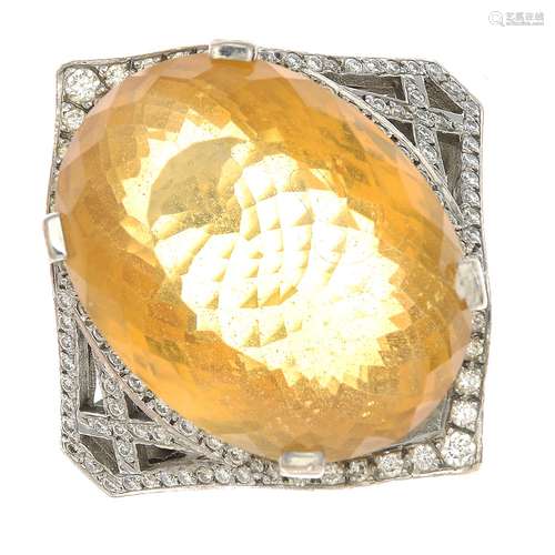 An 18ct gold citrine and diamond dress ring.Citrine calculated weight 42.70cts,