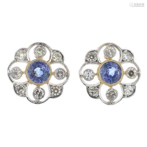 A pair of sapphire and diamond cluster earrings.Estimated total diamond weight 0.55ct,