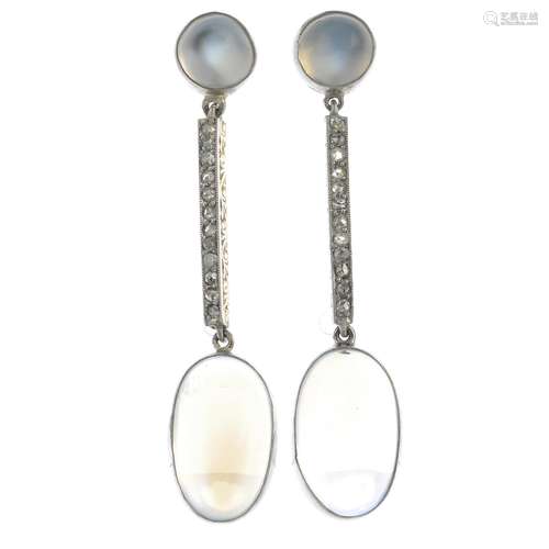 A pair of moonstone and diamond earrings.Total moonstone weight 10.28cts.Length 4.1cms.