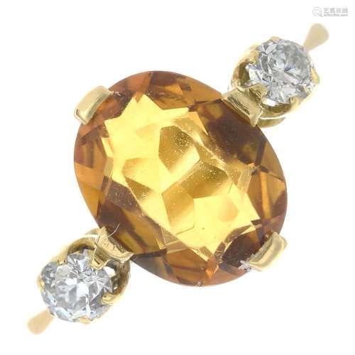 A citrine and diamond three-stone ring.Citrine calculated weight 1.90cts,