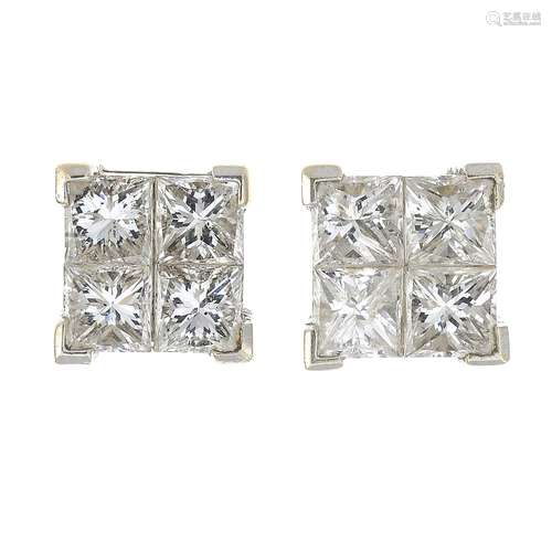 A pair of square-cut diamond cluster earrings.Estimated total diamond weight 2cts,