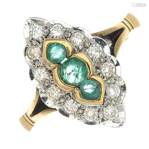 A 9ct gold emerald and diamond dress ring.Estimated total diamond weight 0.35ct.