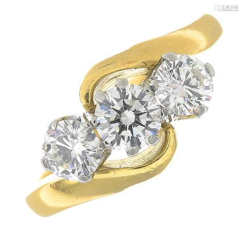 An 18ct gold three-stone diamond ring.Estimated total diamond weight 1.15cts,