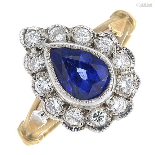 A 9ct gold sapphire and diamond cluster ringSapphire calculated weight 1.29cts,