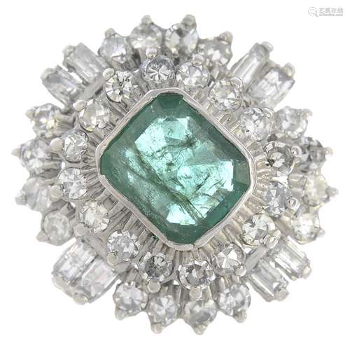 An emerald and diamond cluster ring.Emerald calculated weight 2.38cts,