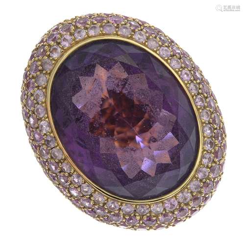 An amethyst and sapphire dress ring.Amethyst calculated weight 28.41cts,