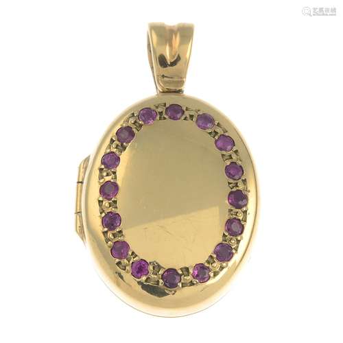 A 9ct gold ruby oval-shape locket.Hallmarks for Birmingham, 2000.Length 3.2cms.