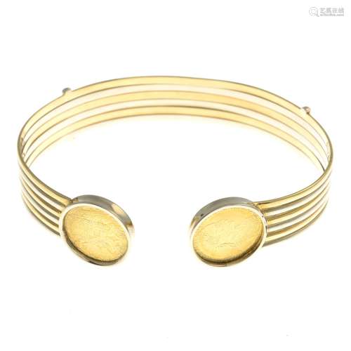 A bi-colour bangle, with coin terminals.Stamped 18K.