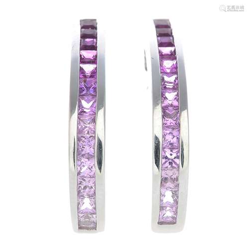 A pair of 18ct gold pink sapphire hoop earrings.Hallmarks for London, 2002.Length 2.5cms.