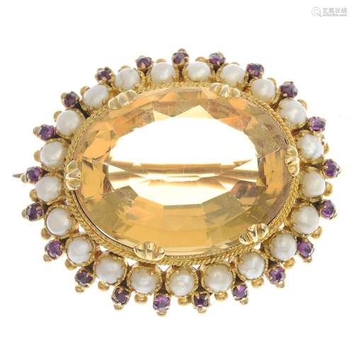 An early 20th century gold citrine, ruby and split pearl brooch.