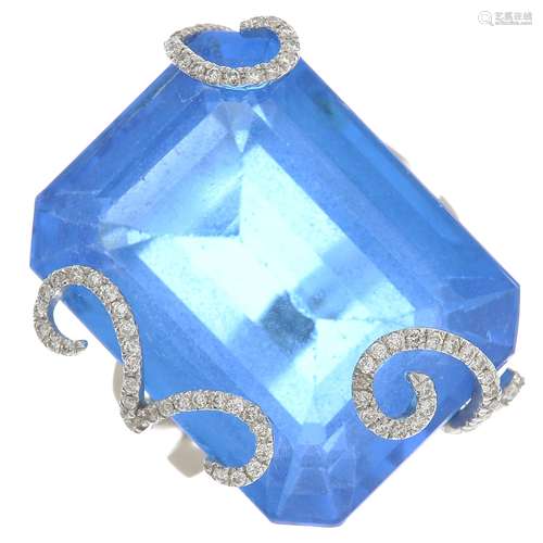 A synthetic blue gem and diamond dress ring.Two diamonds deficient.Estimated total diamond weight