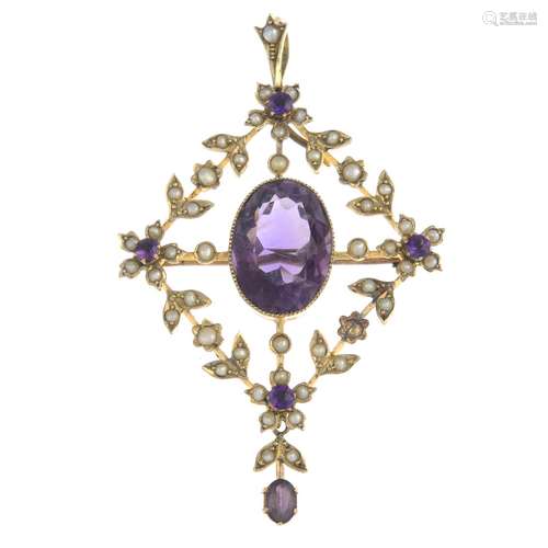 An early 20th century gold amethyst and split pearl pendant.Length 6.2cms.