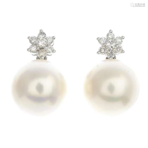 A pair of cultured pearl and diamond earrings.Estimated total diamond weight 0.50ct.Cultured pearls