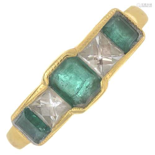 An emerald and diamond five-stone ring.Estimated total diamond weight 0.50ct,