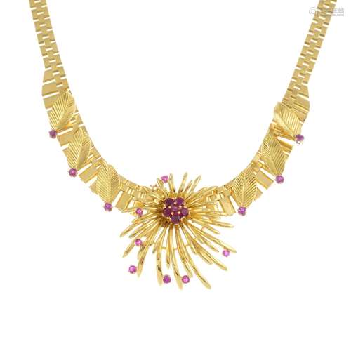 A 1960s 9ct gold necklace, with floral spray and ruby highlights.