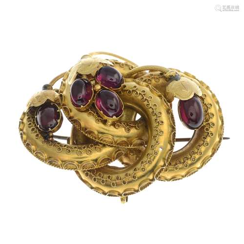 A mid 19th century gold garnet set brooch.Length 5.2cms.