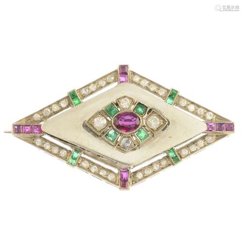 A diamond, emerald and ruby brooch.