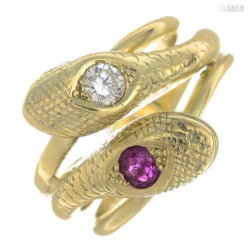 A diamond and ruby double snake ring.Ruby weight 0.35ct.Estimated diamond weight 0.25ct,