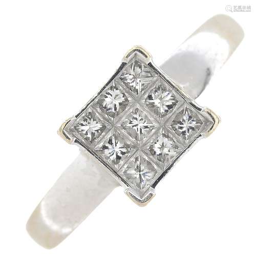 An 18ct gold square-cut diamond cluster ring.Estimated total diamond weight 0.60ct,