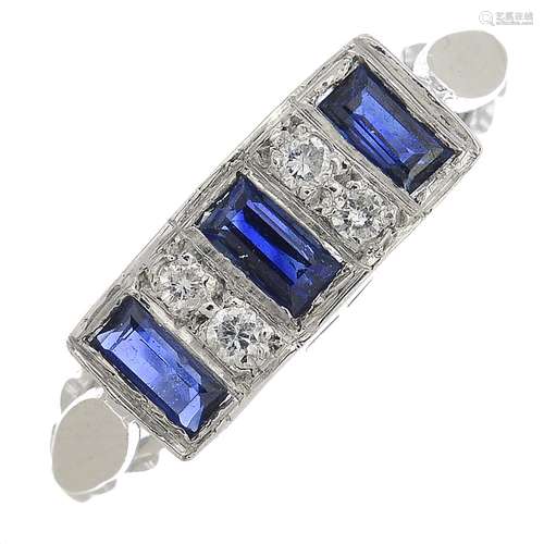 An 18ct gold diamond and sapphire dress ring.Estimated total diamond weight 0.10ct.Hallmarks for