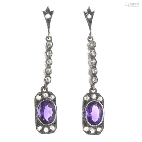 A pair of amethyst and diamond earrings.Length 3.8cms.