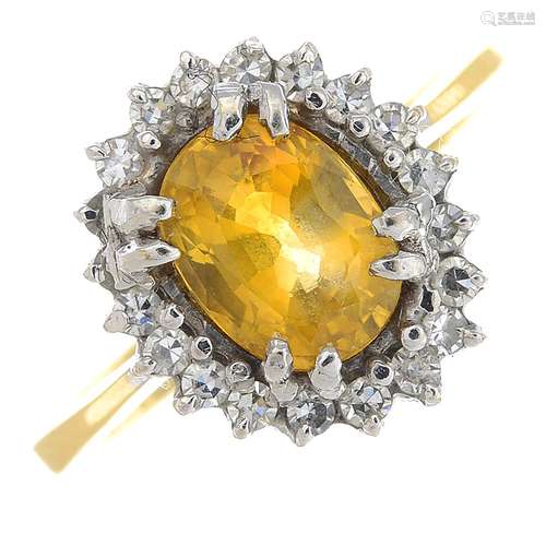 An 18ct gold yellow sapphire and diamond cluster ring.Calculated sapphire weight 1.53cts,