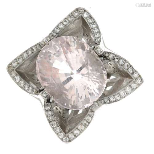 A platinum kunzite and diamond dress ring.Kunzite calculated weight 27.20cts,