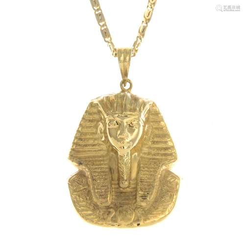 A Pharaoh pendant, suspended from a fancy-link chain.Foreign marks.Length of pendant 5cms.