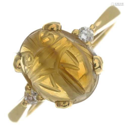 An 18ct gold beryl scarab and diamond ring.Hallmarks for Edinburgh, 2004.Ring size N.