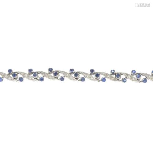 A sapphire and diamond bracelet.Estimated total diamond weight 0.20ct.